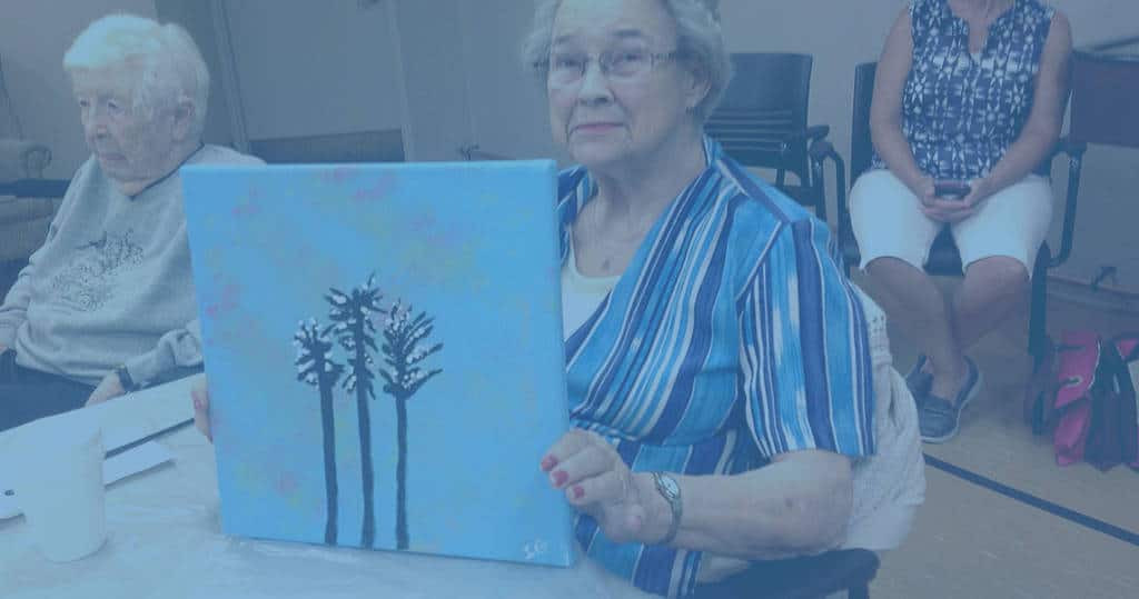 photo of a woman with painting handcraft