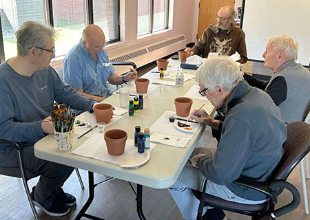 photo: group of elders painting pictures