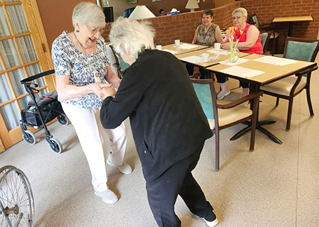 photo: two elderly women dancing