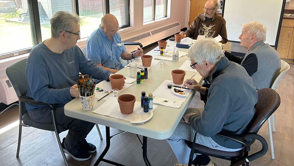 photo: group of elders painting pictures