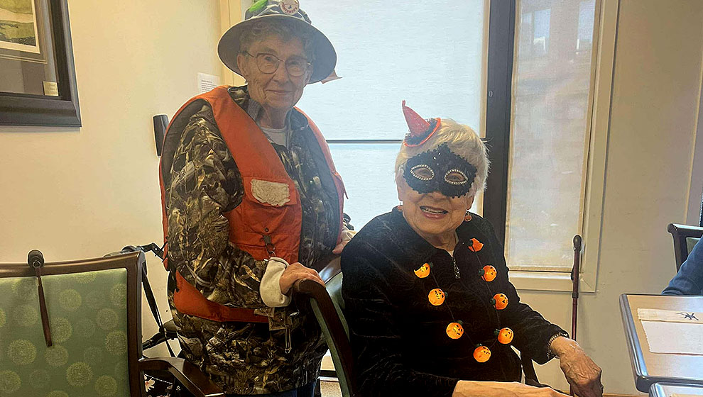 photo: two elderly women in halloween costumes