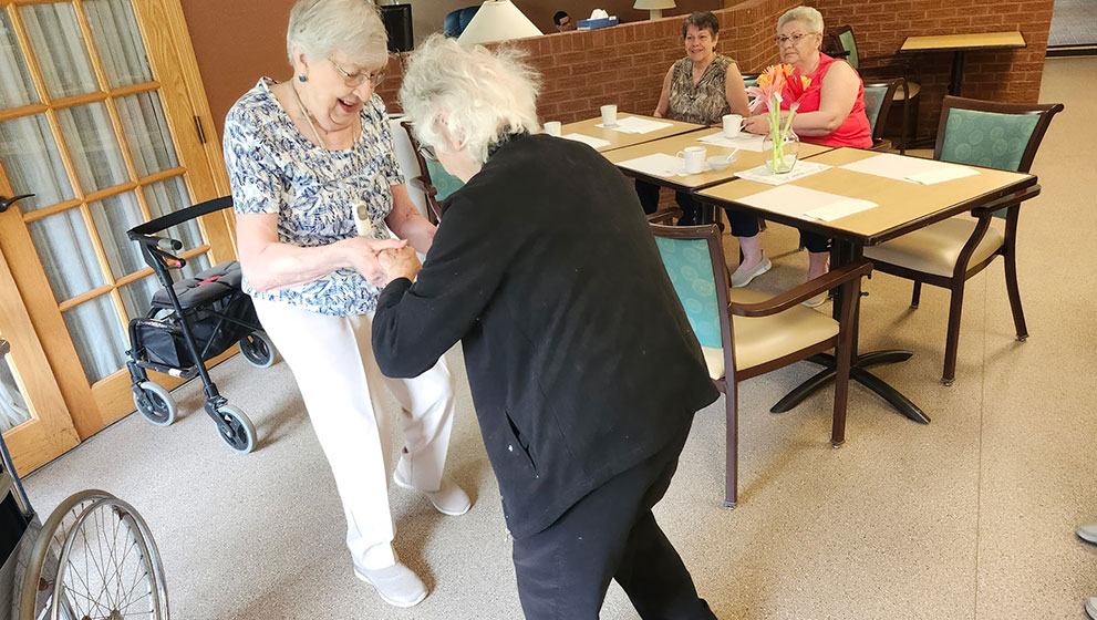 photo: two elderly women dancing